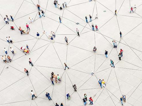 Mathematical Epidemiologist - a photo of people walking in an empty space with lines connecting them